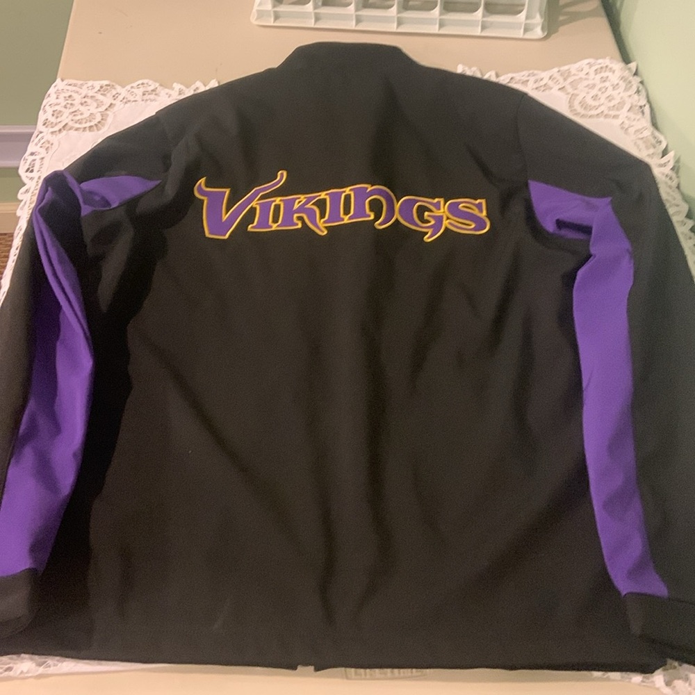 NFL VIKINGS STADIUM JACKET. Black, purple, gold embroidery. Like new. Medium